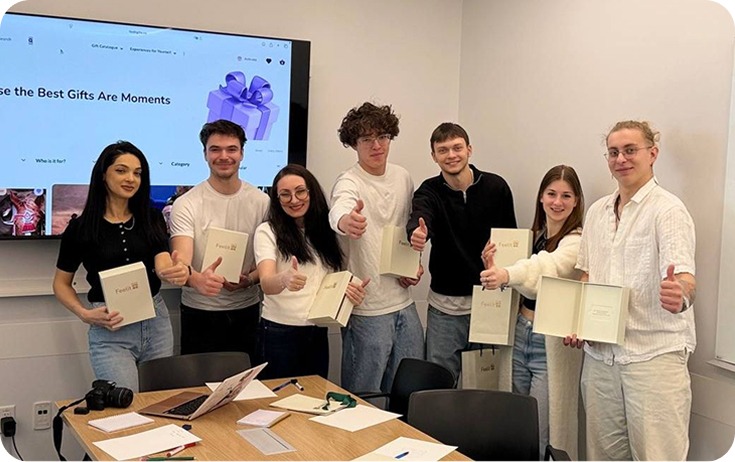 Team holding gift boxes